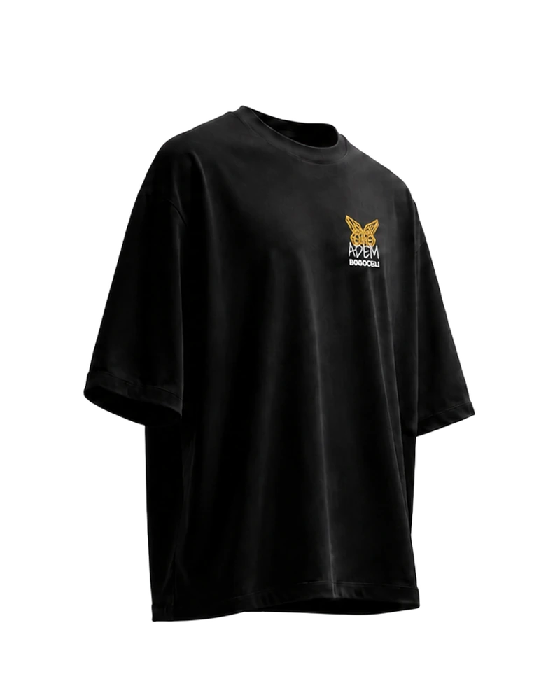 EMPOWERMENT Oversized Half Wing - schwarzes Oversized-Unisex-T-Shirt mit orangefarbenem Print, Seitenansicht